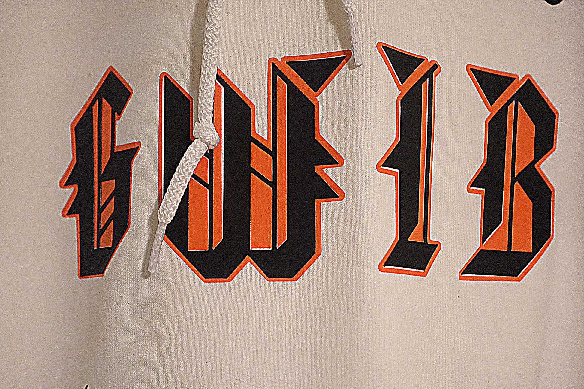 Close-up of a hoodie with 'GWIB' printed in black and orange across the chest.