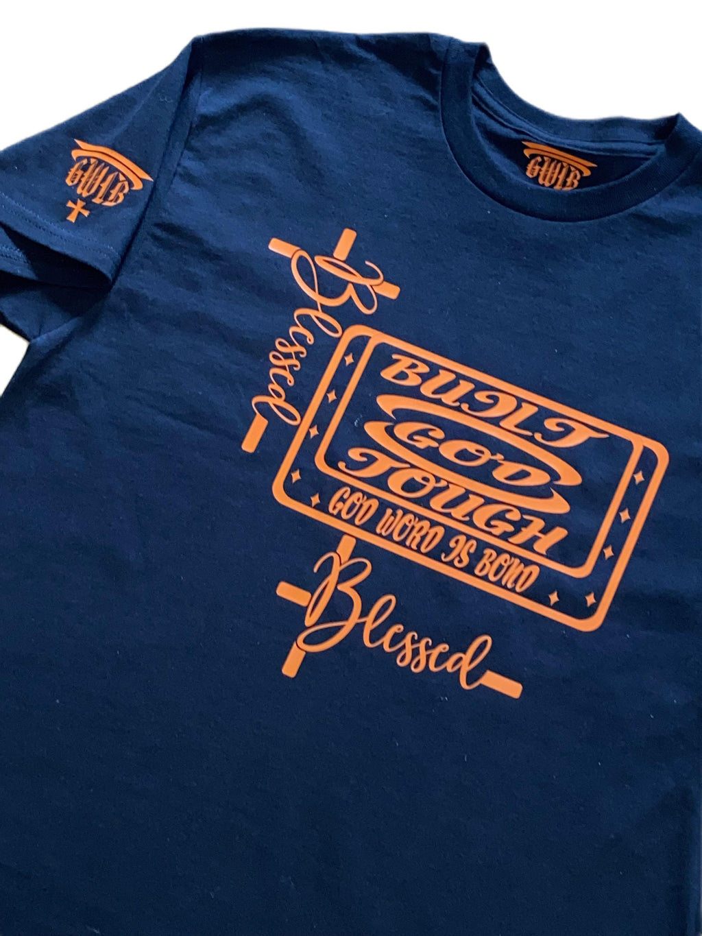 Blue t-shirt with orange graphic design on a white background