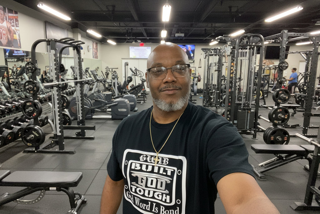 Black T-Shirt with motivational white and silver Built God Tough design on the front and the word Blessed with a cross on the back
