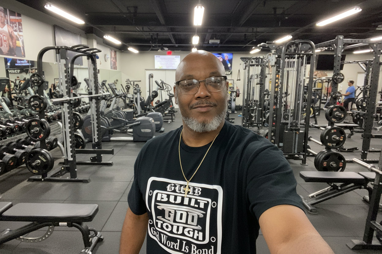 Black T-Shirt with motivational white and silver Built God Tough design on the front and the word Blessed with a cross on the back