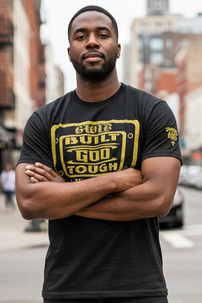 Built God Tough T shirt in black with a gold glitter design.